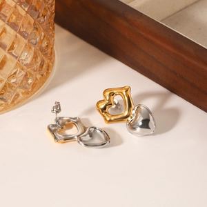 Minimalist gold and silver two-tone double heart stud earrings in polished stainless steel