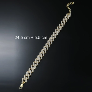 Close-up of iced out gold cuban link anklet with 24.5cm plus 5.5cm size tag