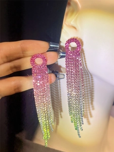 Detail of long tassel rhinestone earrings with pink to green gradient crystals