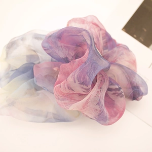 Detailed macro view of large oversized gradient pink and purple organza scrunchie