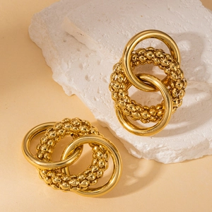 Chic 18K gold plated stainless steel intertwined hoop earrings on white stone