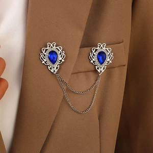 Detail of vintage silver collar chain with blue water drop gems and crystal fringe