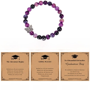 Detail of 8mm purple agate bead bracelet with butterfly charm and graduation cards