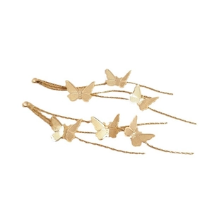 Golden butterfly earrings with long tassel chains on a clean white background