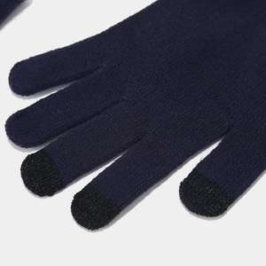 Detail of dark blue cable knit touchscreen gloves with conductive black fiber fingertips