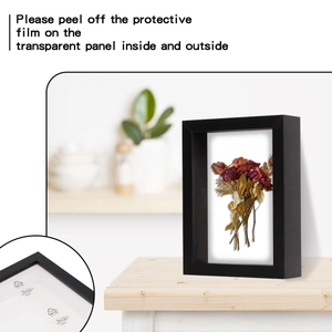 Detail of 3D shadow box frame showing PE film and dried rose inside for display