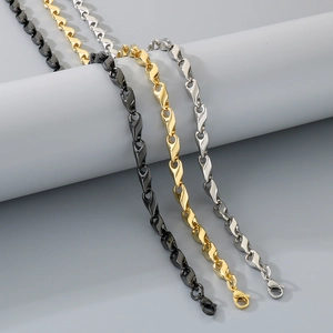 Detailed view of silver, gold, and black twisted link chains with lobster clasps