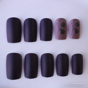 Matte dark purple press-on nails with autumn leaf flower design in medium square shape