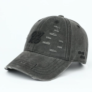 Detail of distressed dark grey baseball cap with KO 3D embroidery and washed finish