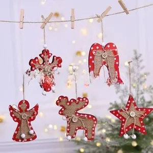 Detail of five wooden Christmas ornaments with red dots and linen centers on jute rope