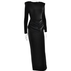 Close-up of ruched waist detail and long sleeves on a black bodycon maxi dress