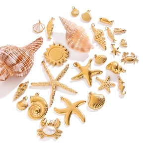 Golden nautical jewelry charms with starfish, shells and white enamel for DIY accessories