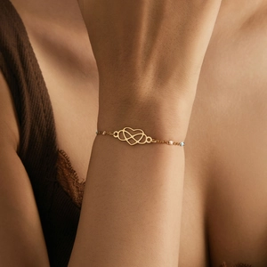 Elegant 18k gold heart and infinity bracelet featuring colorful beads for women