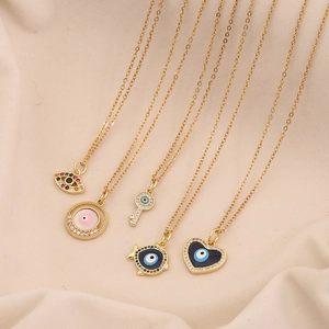 Set of five gold evil eye pendant necklaces with colorful enamel and crystal inlays