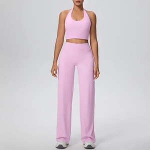 Detailed front view of women's light pink yoga set with halter top and wide-leg pants