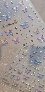 Vue macro des stickers ongles papillon 3D avec bordures dorées et détails étoilés