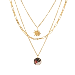 Three-layer gold stainless steel necklace with sun and moon enamel celestial pendants