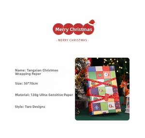 Christmas wrapping paper detail showing 50x70cm 128g paper with Santa and snowflake motifs