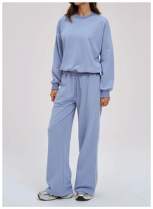 Light blue two-piece lounge set with crewneck sweatshirt and high-waisted wide-leg pants