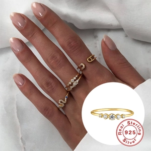 Elegant 925 sterling silver V-shaped opal ring with gold finish and sparkling zirconias