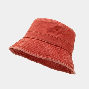 Close-up of brick red washed cotton bucket hat with stitching details and air vents