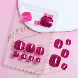 Macro shot of rose red glitter press-on toenails on premium display stand