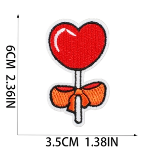 Detail view of heart lollipop embroidered patch with measurements in 6cm x 3.5cm