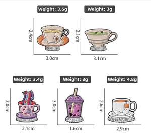 Detailed view of creative enamel tea cup pins showing weights and product dimensions