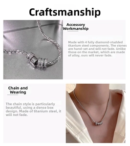 Detail of titanium steel box chain with four crystal-studded ring pendants on a model
