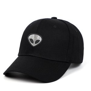 Detailed side view of black vintage baseball cap with silver alien head embroidery