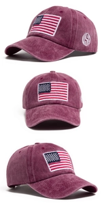 Macro detail of washed burgundy cotton fabric and USA flag embroidery on the baseball cap