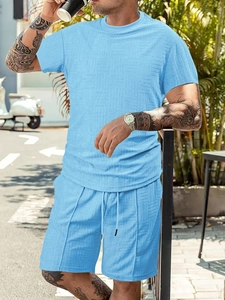 Close-up of men's summer short set showing light blue waffle knit texture and fabric
