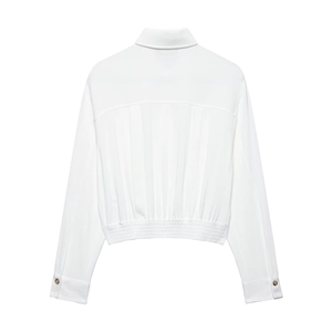 Detailed back view of white long sleeve shirt with pleats and elastic hem finish