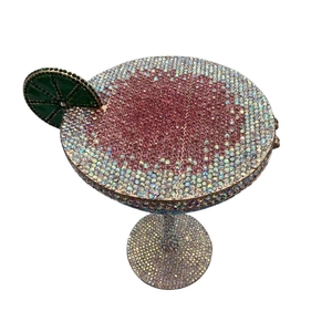 Detailed view of martini crystal evening bag with pink rhinestones and a green lemon slice