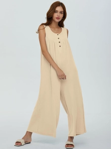 Detail of beige ribbed knit sleeveless jumpsuit with functional buttons on the neckline