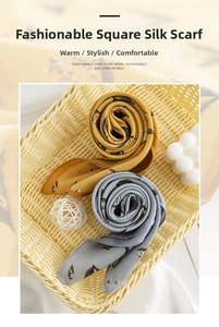 Detailed view of floral silk-feel square scarves in yellow and blue colors