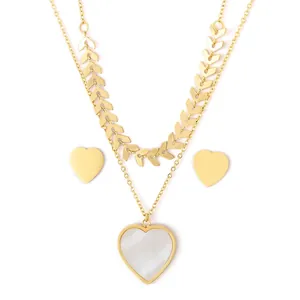 Double-layered gold wheat chain necklace and heart earrings set with white shell