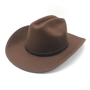 Detailed top view of a dark brown felt cowboy hat with a black woven decorative band