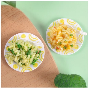 Miniature dollhouse food set featuring fried rice models on patterned plates with tiny spoons
