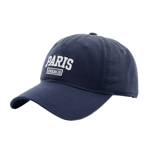 Navy blue cotton baseball cap featuring white Paris French embroidery in a flat layout