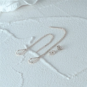 Macro detail of S925 sterling silver long tassel ear threads with teardrop pendants