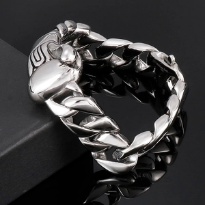 Macro view of 316L stainless steel Cuban chain bracelet with focused metal textures