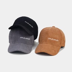 Close-up of Mama embroidered corduroy baseball caps in black, grey and khaki brown