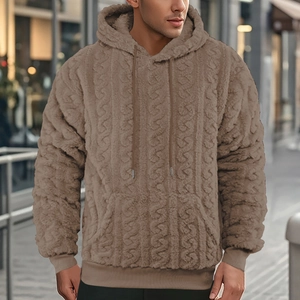 Detailed texture of brown teddy fleece hoodie featuring drawstring hood and ribbed cuffs