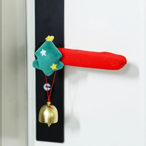 Close-up of Christmas door handle cover with plush tree and golden bell decoration