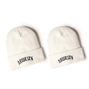 Set of two white BROOKLYN knitted beanies with black embroidered letters for winter