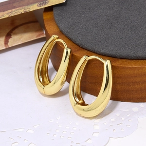 Minimalist gold wave U-shape hoop earrings with a polished finish for women