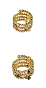 Detail of gold spiral rings with multi-layer pave white zircon and black gemstone