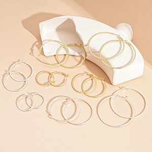 Minimalist matte metal hoop earrings in gold and silver variety of sizes and sets
