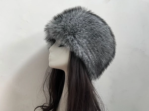 Detailed side view of grey faux fox fur Russian style winter hat on mannequin head